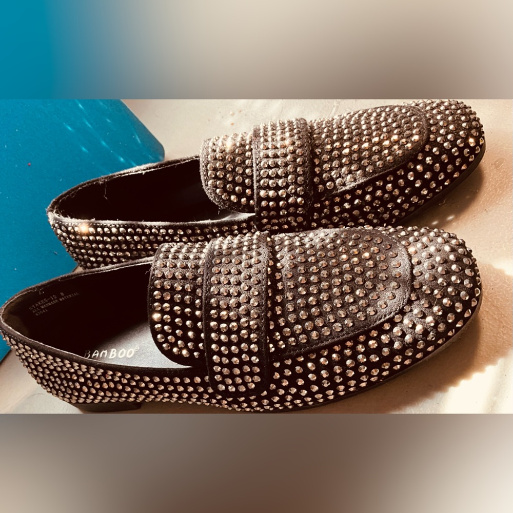 Black studded loafers